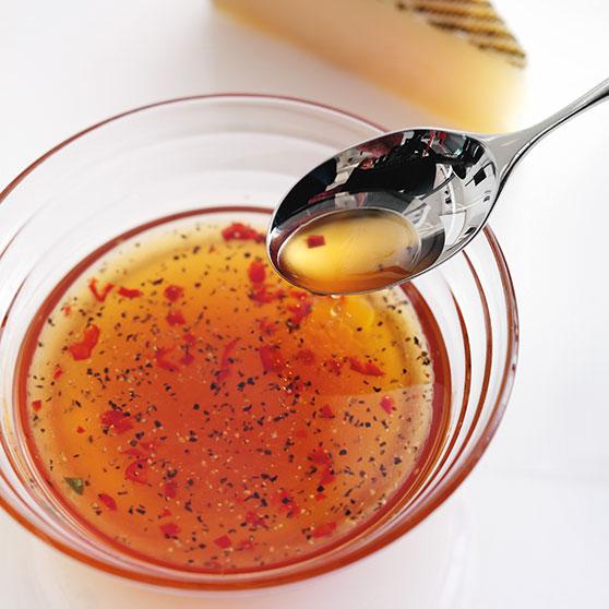 Spicy dressing for cheese